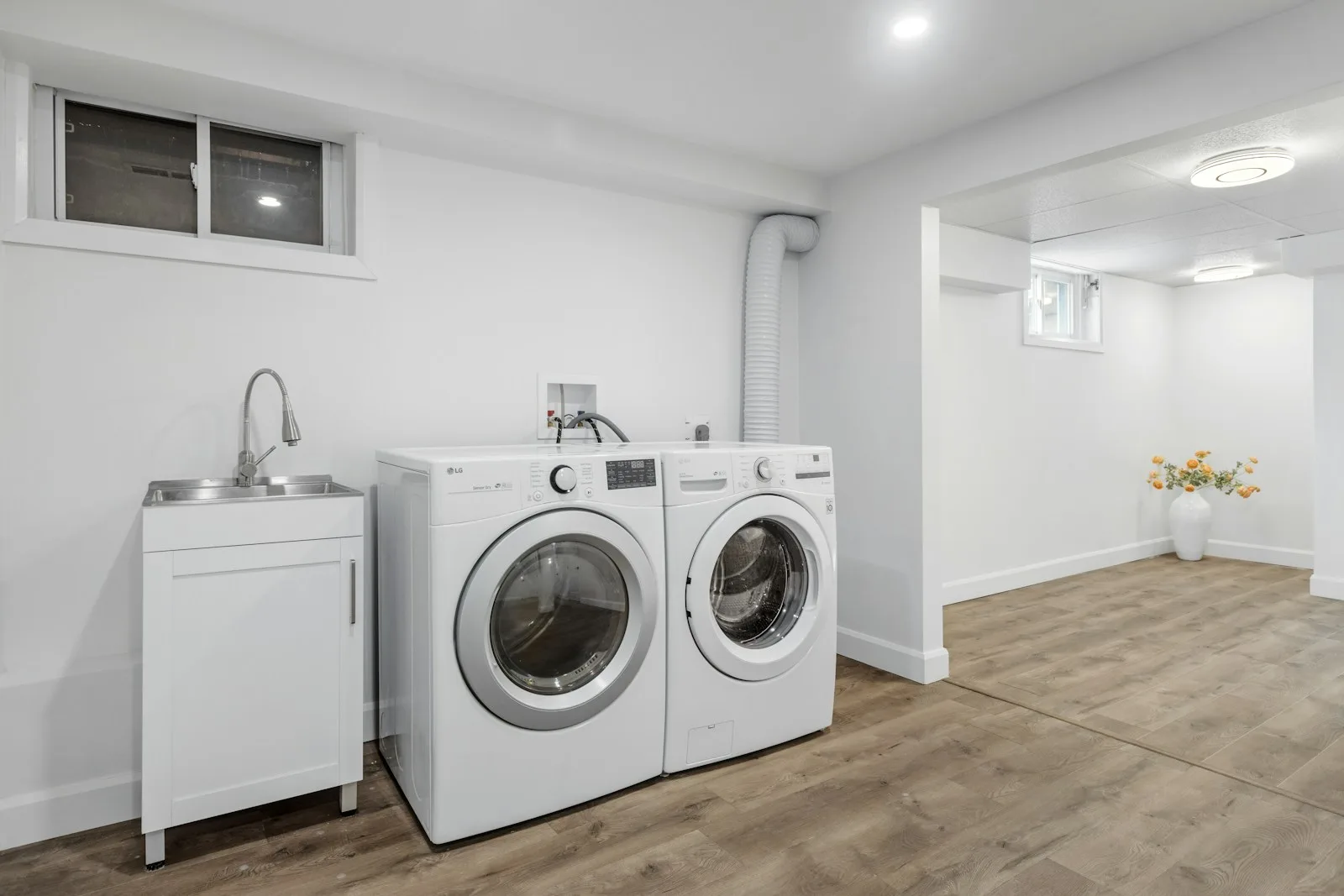 Compact dryer stacked with washer in laundry space
